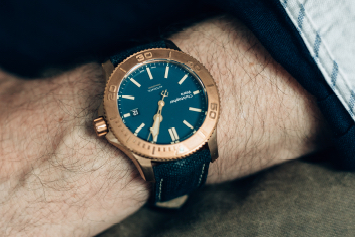 a closeup of a Christopher Ward watch's bezel