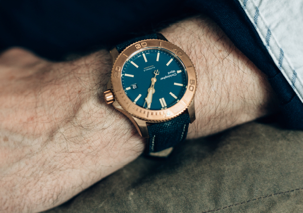 a closeup of a Christopher Ward watch's bezel